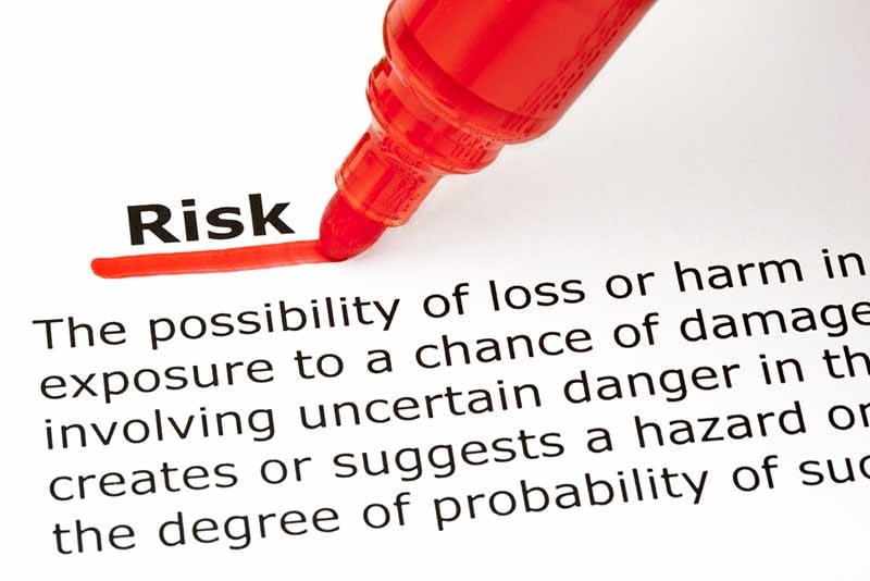 the word "risk" underlined with a red marker pen