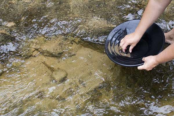 someone panning for gold