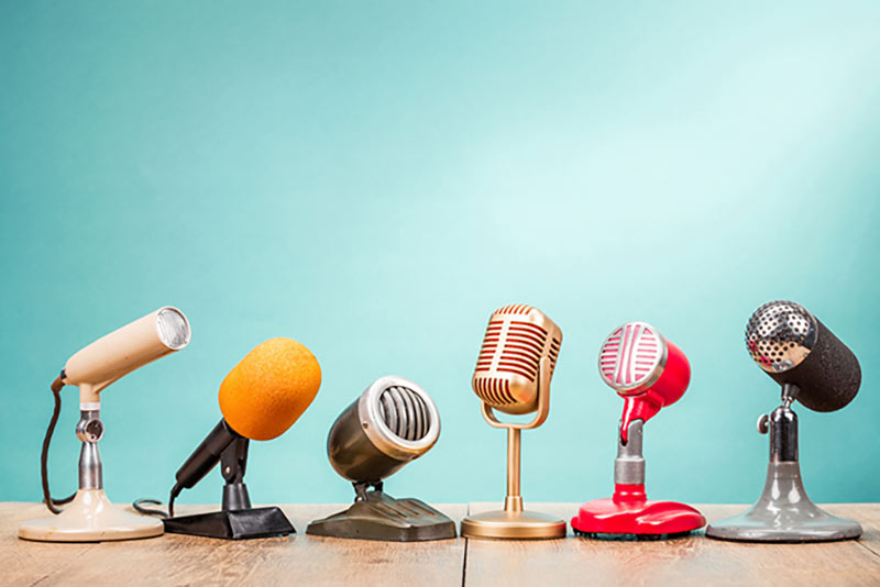 a row of six microphones