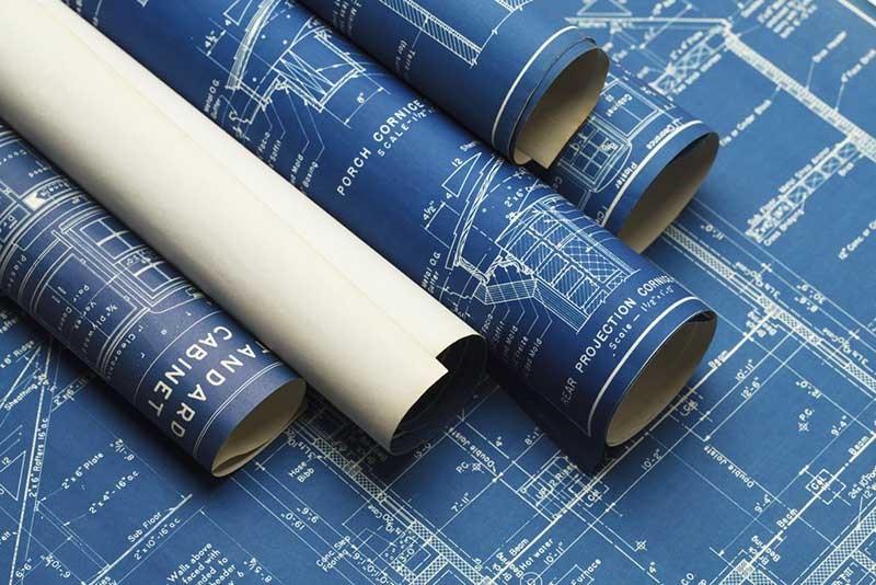 rolled up blueprints